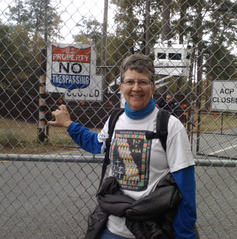 Chris Gaunt outside the fence--which she would shortly cross--at the School of the Americas, Fort Benning Army Base, Columbus, Georgia, in 2011. It was her 14th consecutive year attending the Annual protest.