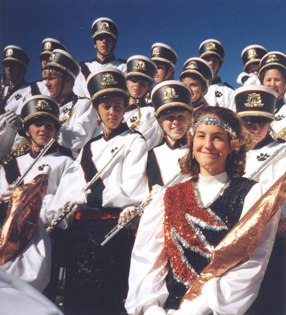 Katie Brandt (lower right corner, wearing headband), performing at the Iowa State Marching Band Festival in high school. Photo courtesy of Bridget Brandt