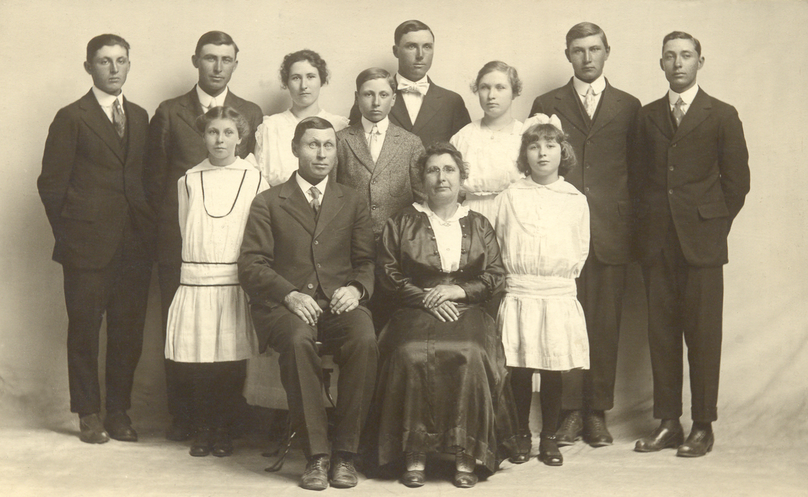 The Janzen family, 1918. Seated Henry and Carrie, standing, left to right, Herbert, Henry, Nellie in front of Henry, Rosie, Wilbert, Albert, Edna, Thelma in front of Edna, Roy, and Edward