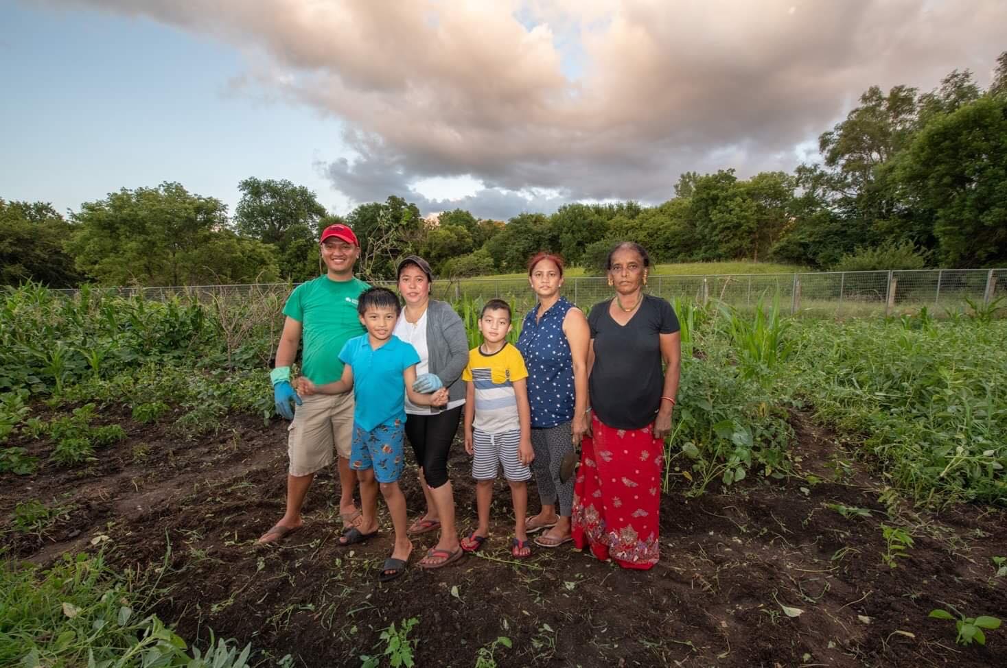 Himal Gurung (at far left) and Indra Gurung (third from far left) with relatives at Global Roots Farm