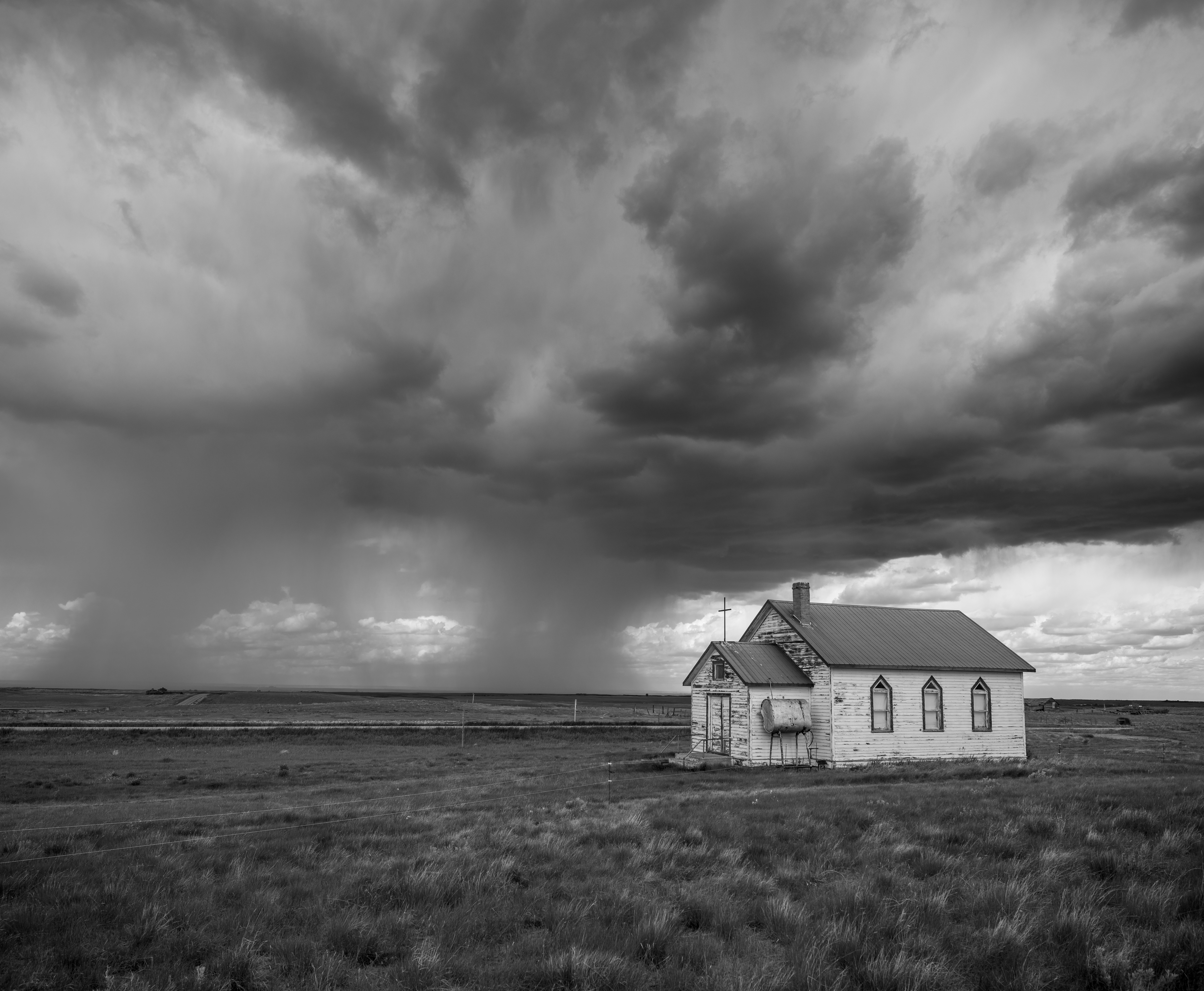 Abandoned school with an approaching storm, Saskatchewan