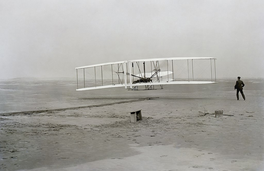The Wright Brothers’ first successful flight, December 17, 1903. Photo courtesy of Wikimedia Commons.