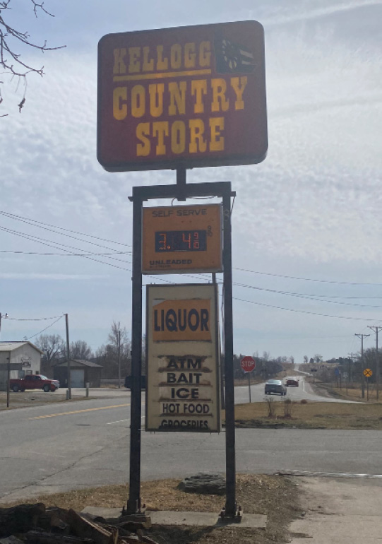 The Kellogg Country Store on March 15, 2022. The store offers gas, access to an ATM, liquor, bait, ice, and--finally--hot food and groceries. Note where food items are on the list. Image courtesy of the author