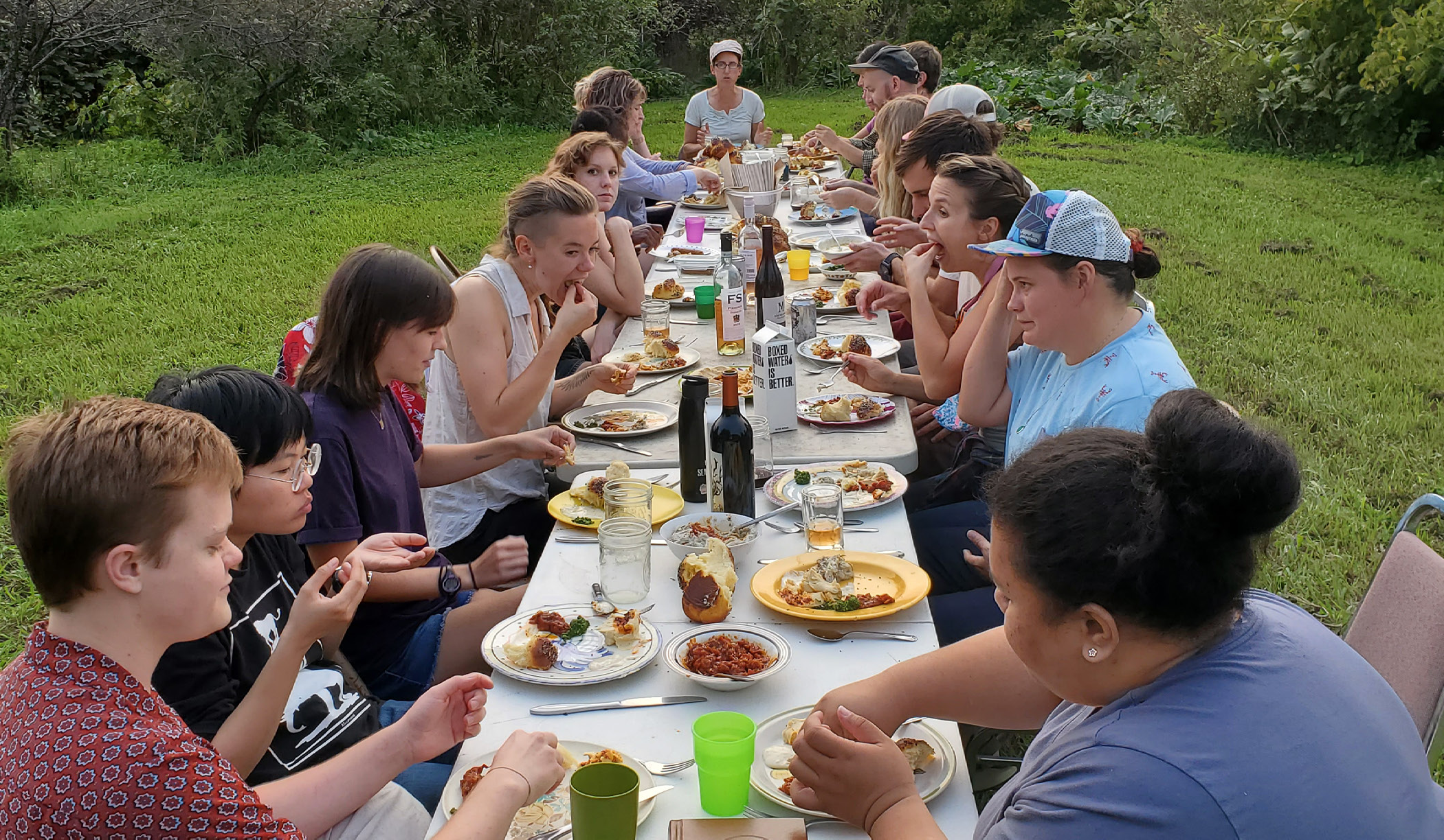 Members of the Mustard Seed Collective gather for a meal.