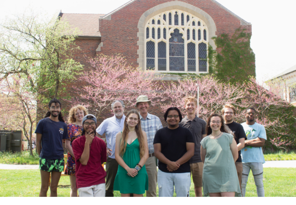 The editorial staff for the Spring 2023 issue of Rootstalk in front of Herrick Chapel at Grinnell College. First row, from left to right: Associate Editors Saul Chan Htoo Sang, Ky Klassen, Francisco Pantoja Martinez, Joanie Fieser. Back row, from left to right: Associate Editors Lucien Akira DeJule and Emma Walsh, Editor-in-chief Mark Baechtel, Publisher Jon Andelson, Associate editors Zach Spindler-Krage, Will Gresham, and Marty Allen. Photo courtesy by Saul Chan Htoo Sang