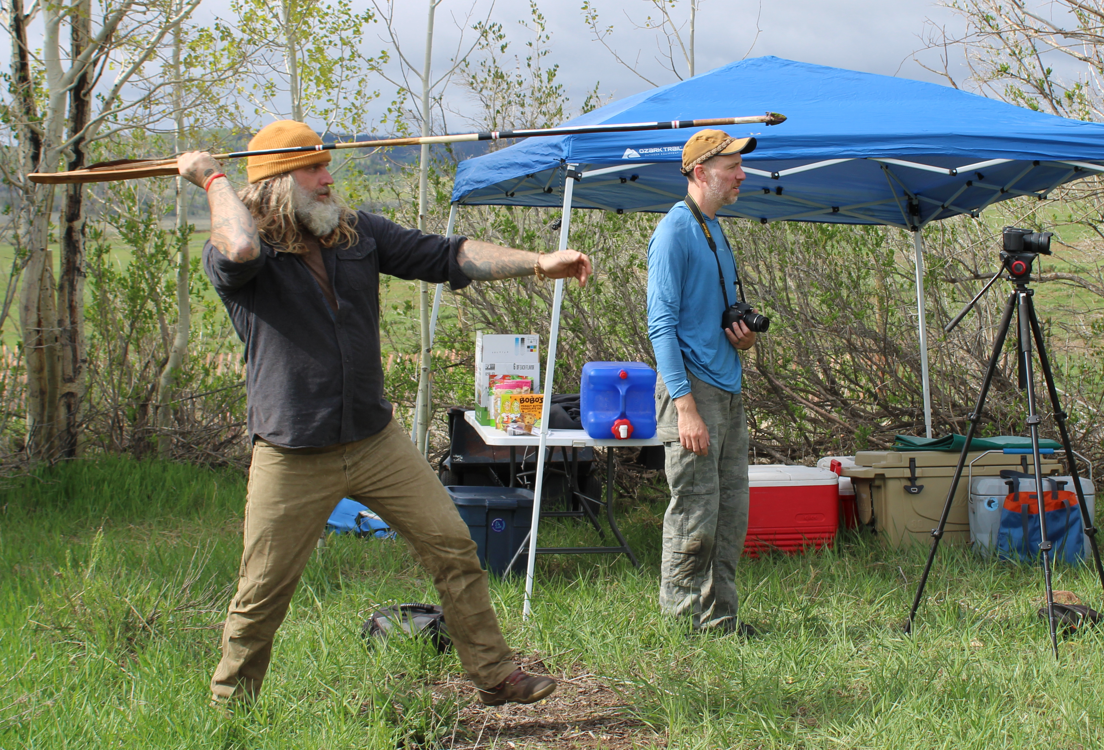 A person launching an Atlatl