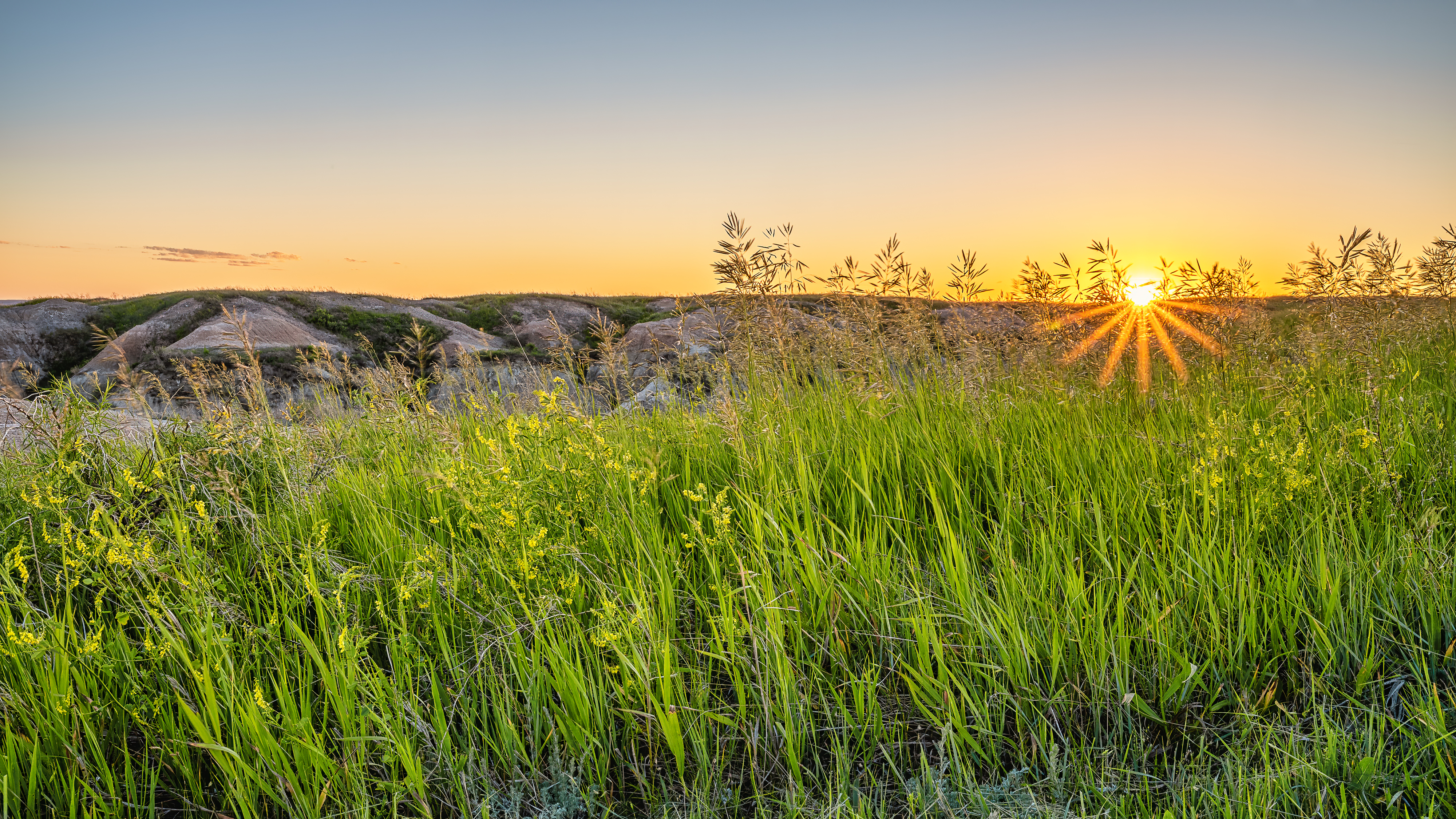 Badlands prairie landscape at sunset