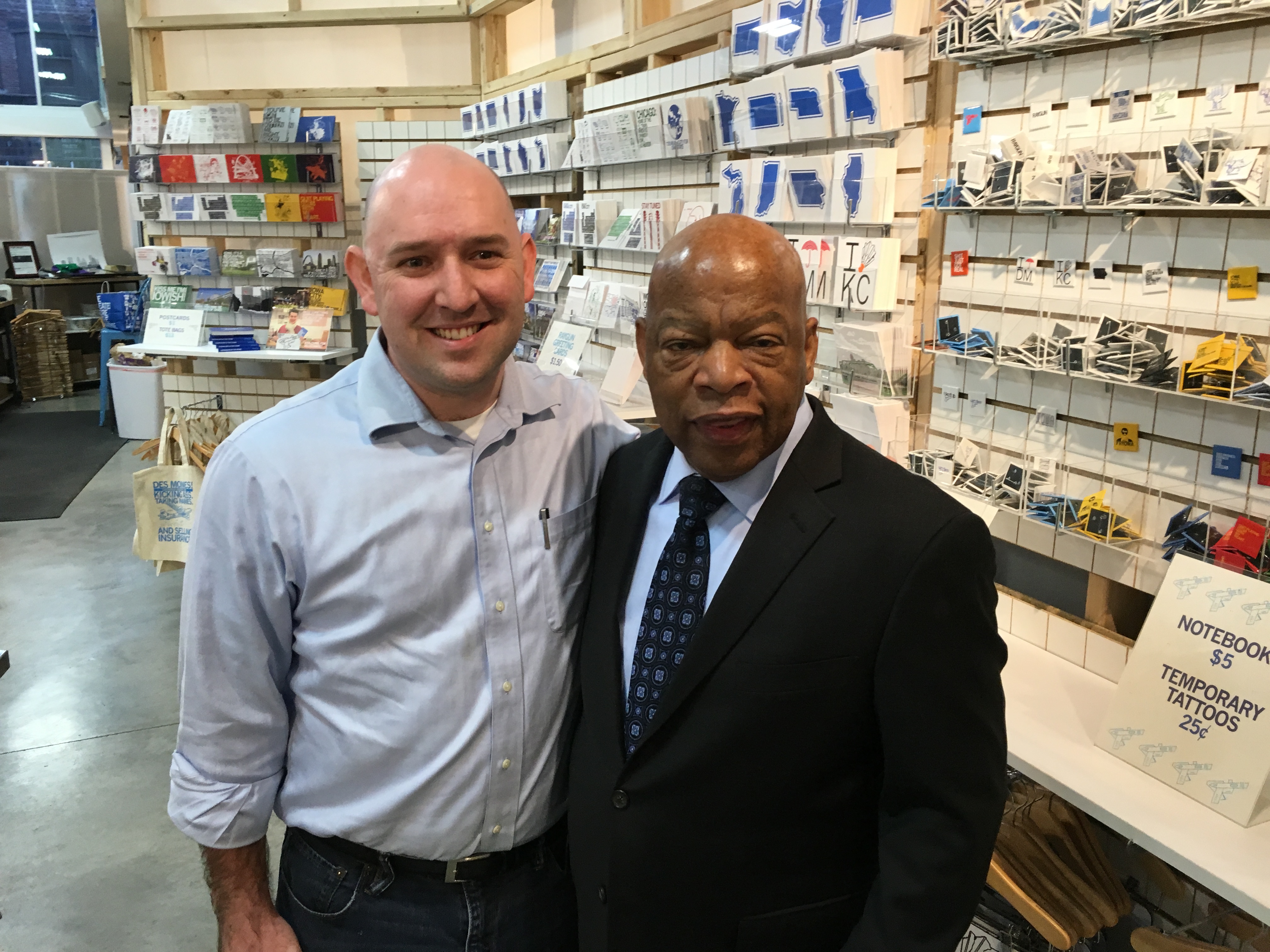 Two men standing together in a store