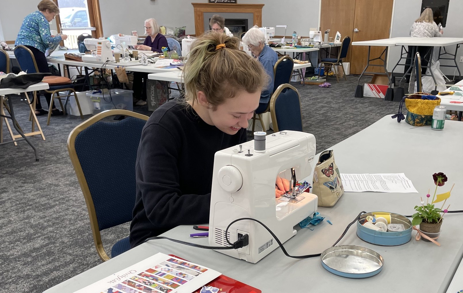 A person using a sewing machine